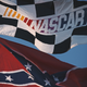 The NASCAR Series flag flies alongside the old Confederate battle flag during the NASCAR Winston Cup Series Primestar 500 race on March 9, 1997, at the Atlanta Motor Speedway in Hampton, Ga. (Darrell Ingham/Allsport/Getty Images)